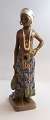 Dahl Jensen. Porcelænsfigur. Pige fra Øst Sierra Leone. Model # 1117. Højde 25 
cm. ( 1 sortering )