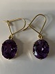 14 carat gold 
earrings with 
purple stone.
Stamped 585.
Length 2.8 cm.
Neat and well 
...