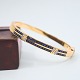 Armring af 18 kt. guld prydet med safirer og diamanter