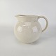 Mælkekande i 
cremefarvet 
fajance fra 
stellet Alma
Producent 
Aluminia
Højde 12 cm 
...