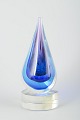 Murano
Drop-shaped 
glass 
sculpture, 
1970s.
Handmade 
sculpture in 
clear and 
blue-violet 
glass, ...