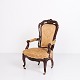 Antique 
armchair made 
of mahogany 
with carved 
details in the 
Rococo style, 
dated to around 
the ...