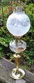 Kerosene lamp, 
circa 1880. 
Brass base, 
clear glass 
container with 
cuts and top 
dome in frosted 
...