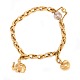 14kt gold Ole 
Lynggaard 
Copenhagen 
bracelet with 
two charms and 
white gold 
clasp
L: 19,5cm