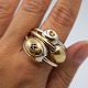 Anette Kræn; Set of three finger rings of silver adorned with gold. One adorned with gold and ...