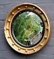 Butlers mirror, 
19. årh. 
England. 
Forgyldt ramme 
med konkavt 
glas. Dia.: 41 
cm. 
