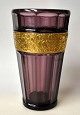 Moser, Ludvig & Söhne, Karlsbad, 1920s: Vase. In violet glass with etched gold frieze with ...