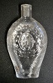 Svensk lommelærke i klart glas med riller, 1872-1907. Klar glas. Præget med Oscar d.2. af ...