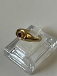 Ladies Ring 14 carat with red stone.Size: 57.