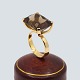 Ulla Kampmann; Ring i 14 kt. guld med topas