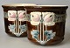 Par Jugend fajance urtepotter, ca. 1900. Tyskland. Polykrom dekoration med blomster. H: 17 cm. ...