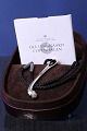 This unique necklace, designed by Ole Lynggaard, is something very special. The simple lines and ...