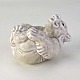 Figur i celadon glaseret stentøj med med motiv af en isbjørneunge liggende på ryggen. Nr. ...