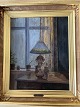 Clemmen Clemmensen (1885-1964):Interiør med petroleumslampe på bord ved vindue.Olie på ...