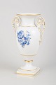 Meissen vase with blue floral decoration.Elegant porcelain vase with pedestal foot and ...