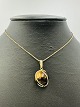 8 Karat Guld Vedhæng med Tigerøje sten Vægt: 4,7g L: ca. 2,5cm Stemplet 333OBS: Sælges ...