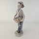 Figur af porcelæn med motiv af en dreng med en paraply.Producent Lladro, SpainFremstår i ...