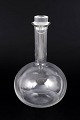 Ole Palsby for Georg Jensen, vinkaraffel.Elegant vinkaraffel i klart glas med minimalistisk, ...