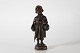 Elna Borch (1869-1950)Stor figur af dreng med bærenet og paraply "Til marked i ...