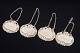Four silver decanter labels.Four decorative silver decanter labels with chains and ...