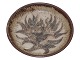 Royal Copenhagen art pottery, a large bowl featuring a stylized flower and sweeping leaves in ...