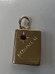 14 karat gold. Book with inlaid red ruby.Charms / Pendants.Height 1.9 cm.
