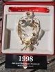 Juleuro 1998 Juleneget i forgyldt messing. Georg Jensen Juleuro 1998, designet af Finn ...