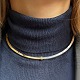 Georg Jensen halssmykke i sterling sølv og forgyldt sølv. Dessin nr. A 21B. Indvendig dia. ca. ...