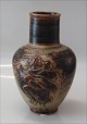 Royal 
Copenhagen 
Stoneware 20247 
RC Vase with 
relief "A 
potter" 22 cm, 
Jais Nielsen, 
March 1931 ...