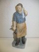 En royal 
copenhagen/kgl 
figur nr 4502 
smed. 
Fremsstillet af 
J. M. Nissen. 
ll. sortering 
og højde ...