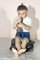 Dahl Jensen, 
porcelæns 
figur. DJ 
figur, dreng 
med trompet nr. 
1218. Højde 
14,5 cm. Dybde 
10,5 ...