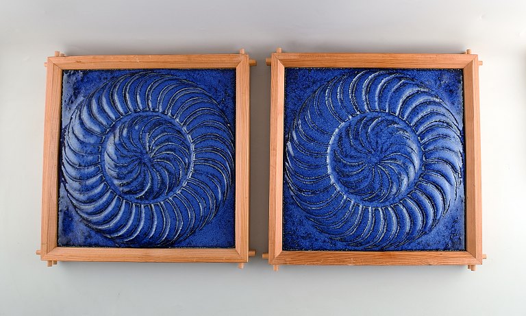 A pair of Large and heavy stoneware reliefs in modern design.
