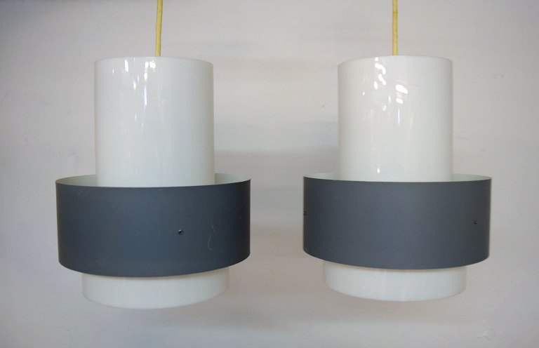 Louis Poulsen: Set of two pendants with shades of grey metal and white plastic.