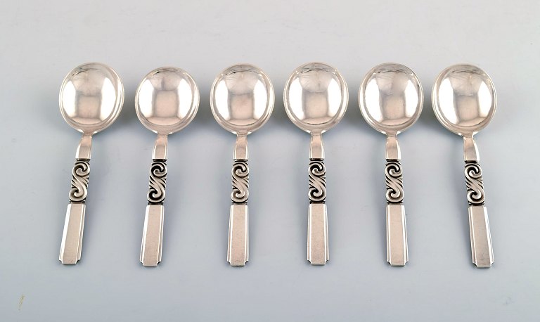 Georg Jensen. Cutlery, Scroll no. 22, hammered Sterling Silver consisting of: 6 
bouillon spoons.