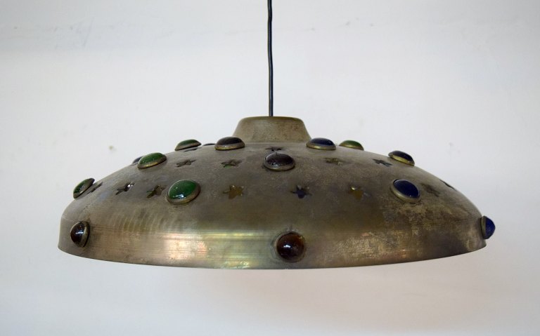 Nanny Still for Raak, Amsterdam. Ceiling lamp in brass decorated with art glass 
in different colors, holes shaped as stars. 1980