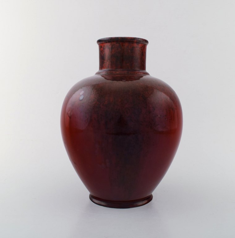 Paul Milet for Sevres. Art deco ceramic vase in beautiful hand painted oxblood 
glaze. France, approx. 1930.