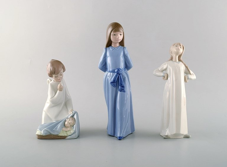 Nao og Lladro. Tre porcelænsfigurer. 1900-tallet.
