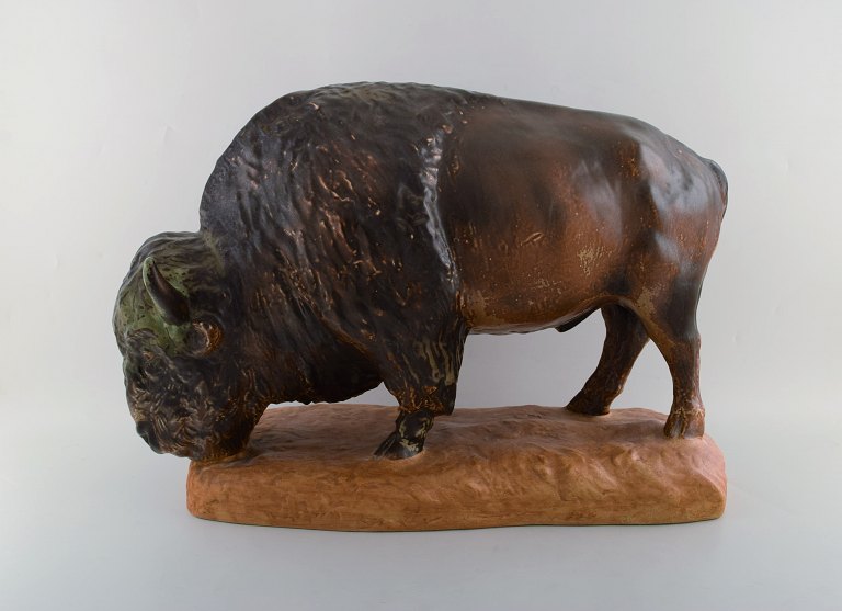 Kuno Norvark (1913-1989) for Bing and Grondahl. Colossal and rare bison ox in 
glazed stoneware. Model Number 7054. Limited Edition # 55/750. Mid 20th century.
