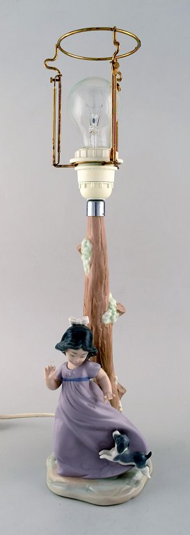 Nao, Spain. Glazed porcelain lamp. Little girl with dog. Dated 1987.
