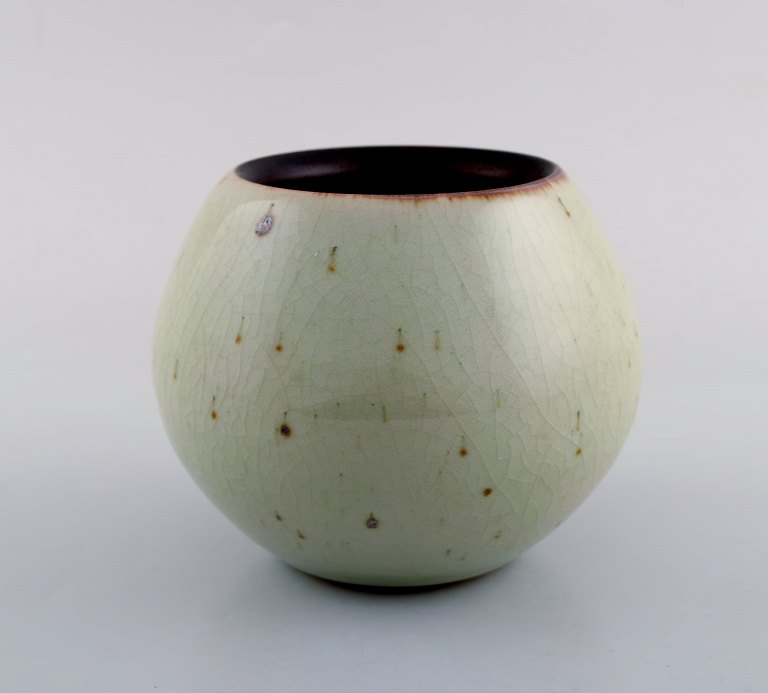 European studio ceramist. Unique vase in glazed ceramics. Beautiful crackled 
glaze in light earth shades. 1980