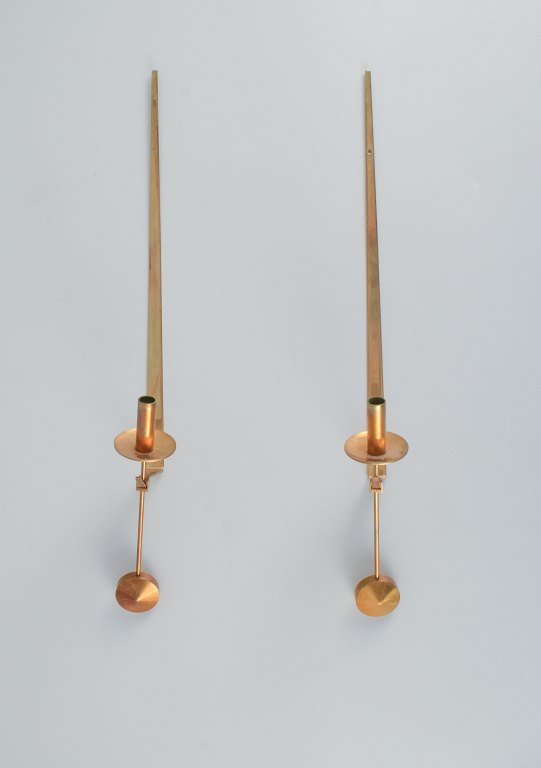 Skultuna, Sweden, four brass candlesticks for wall hanging.Designed by Pierre Forsell.