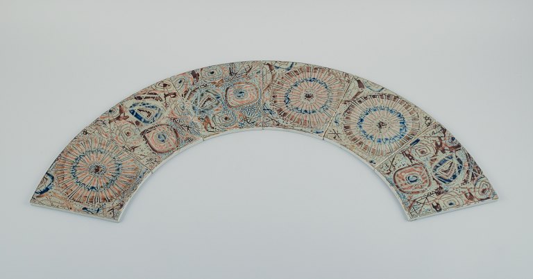 Royal Copenhagen, six Baca faience tiles with patterned glaze in brown, blue, 
green and sand colours.