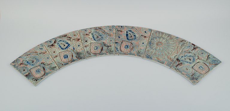 Royal Copenhagen, six Baca faience tiles with patterned glaze in brown, blue, 
green and sand colours.