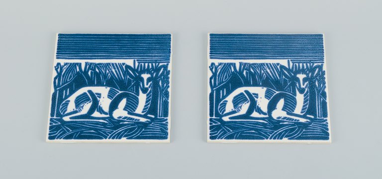 Axel Salto for Royal Copenhagen, two rare tiles. Motif of reclining deer.
Mid 20th century.