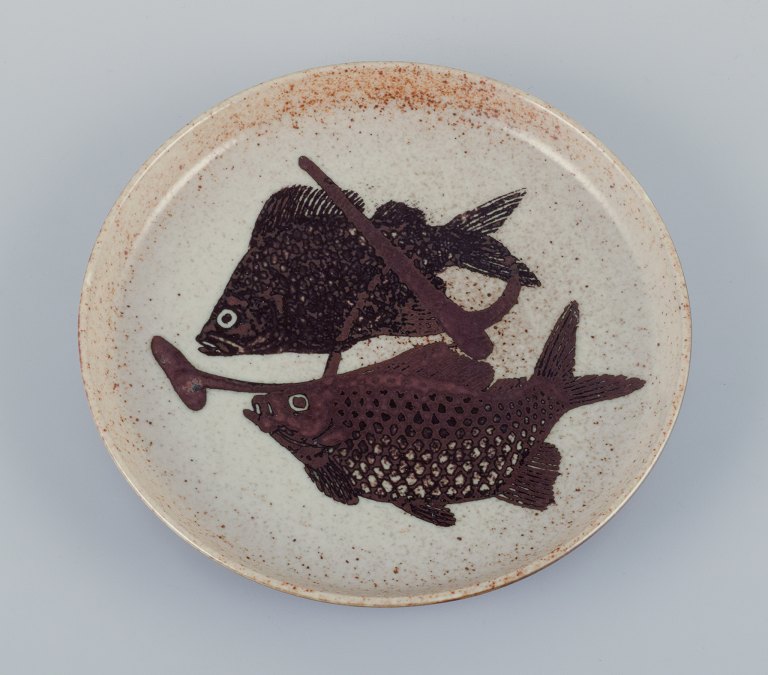 Nils Thorsson for Royal Copenhagen, unique ceramic dish decorated with fish. 
Glazed in brown tones.