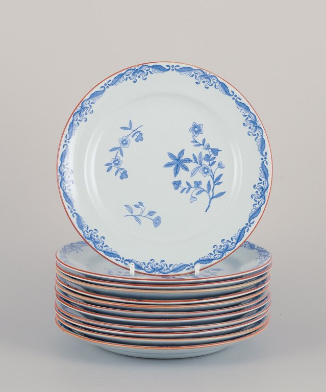 Nils Emil Lundström for Rörstrand, Sweden. A set of twelve "Ostindia" plates in 
faience with flower motifs.