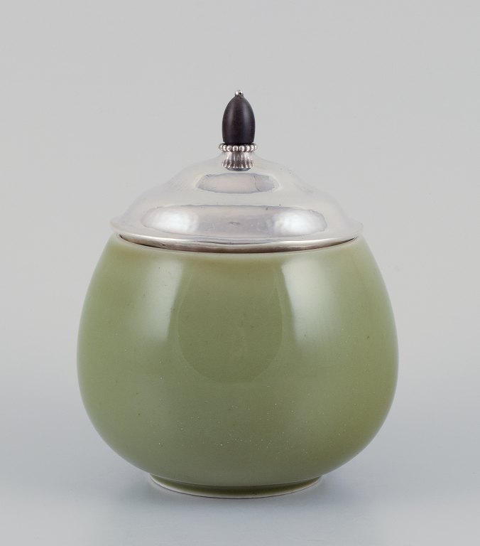 Royal Copenhagen ceramic jar. Silver lid with an ebony knob.
Celadon glaze.