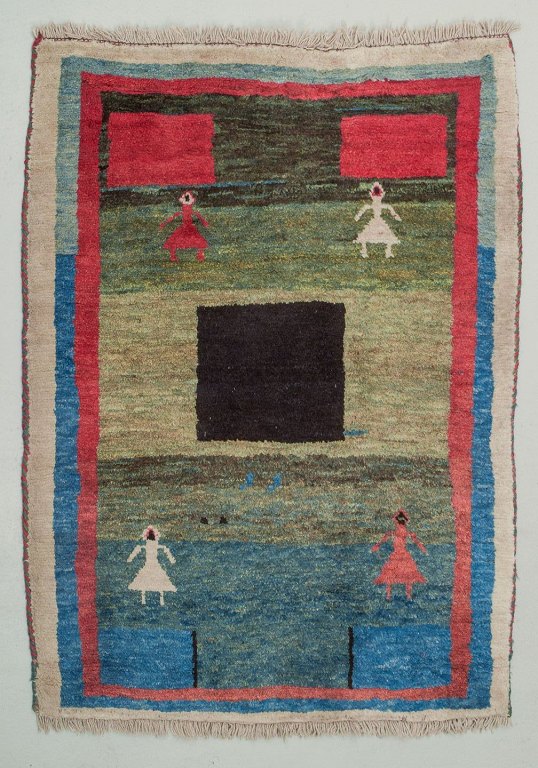 Swedish textile designer. Carpet in pure wool. Handwoven.Designed with figures and geometric fields in various colors.