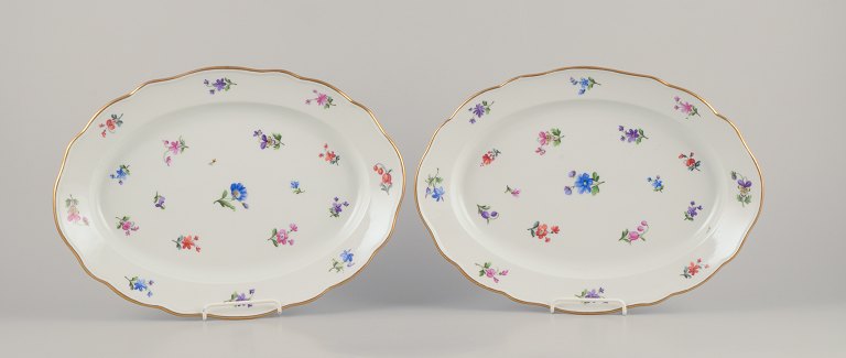 Meissen, Germany. Two oval serving platters in porcelain.Hand-painted with polychrome floral motifs.