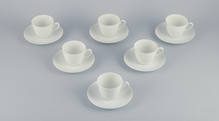 Axel Salto for Royal Copenhagen. Seks par kaffekopper i hvidt porcelæn.